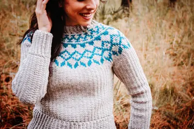 Model in the Arizona Crochet Sweater Dress with a teal diamond colorwork yoke