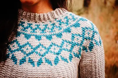 Close up of the teal diamond colorwork yoke on the Arizona Crochet Sweater Dress