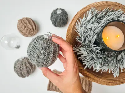Autumn Wheat Bauble Ornaments in gray and oatmeal tones with a candle and greenery