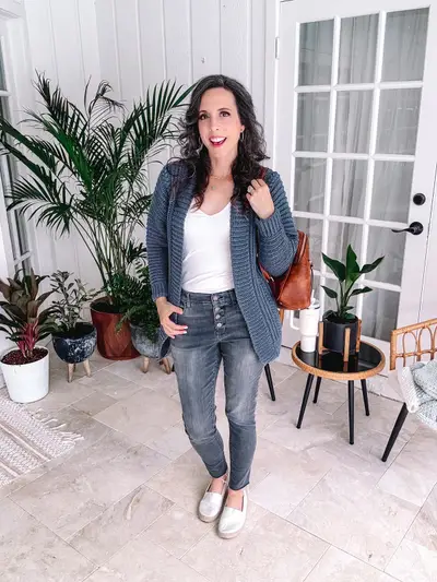 Denim blue Autumn Wheat Flat Cardigan worn with jeans in a bright room