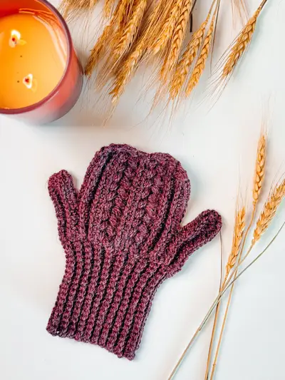 Plum Autumn Wheat Flat Crochet Mitten with a ribbed cuff, laid flat