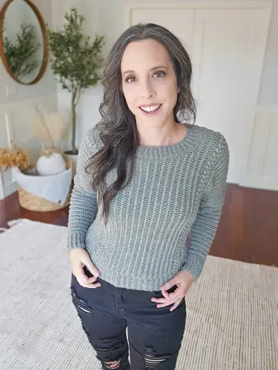 Woman wearing the gray Autumn Wheat Flat Sweater, a fitted crew neck pullover