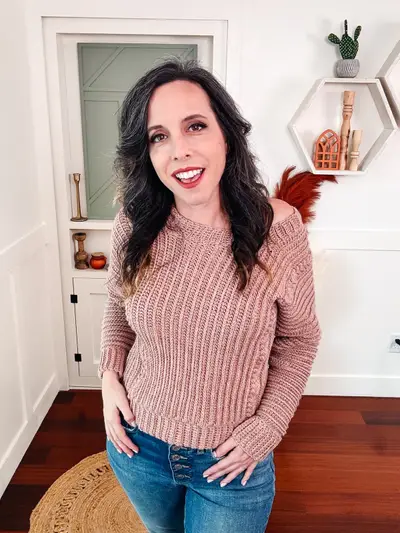 Smiling woman in the blush pink Autumn Wheat Flat Sweater