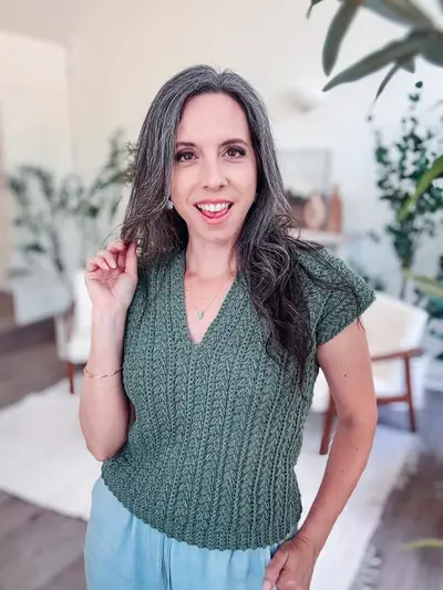 Woman wearing the sage green Braided Wheat Easy Summer Top
