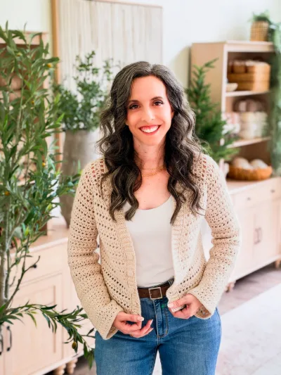Cream Breeze V Neck Crochet Cardigan worn over a white tank with jeans