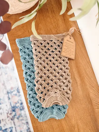 Tan and blue Circle Leaf Plastic Bag Holders on a wooden counter