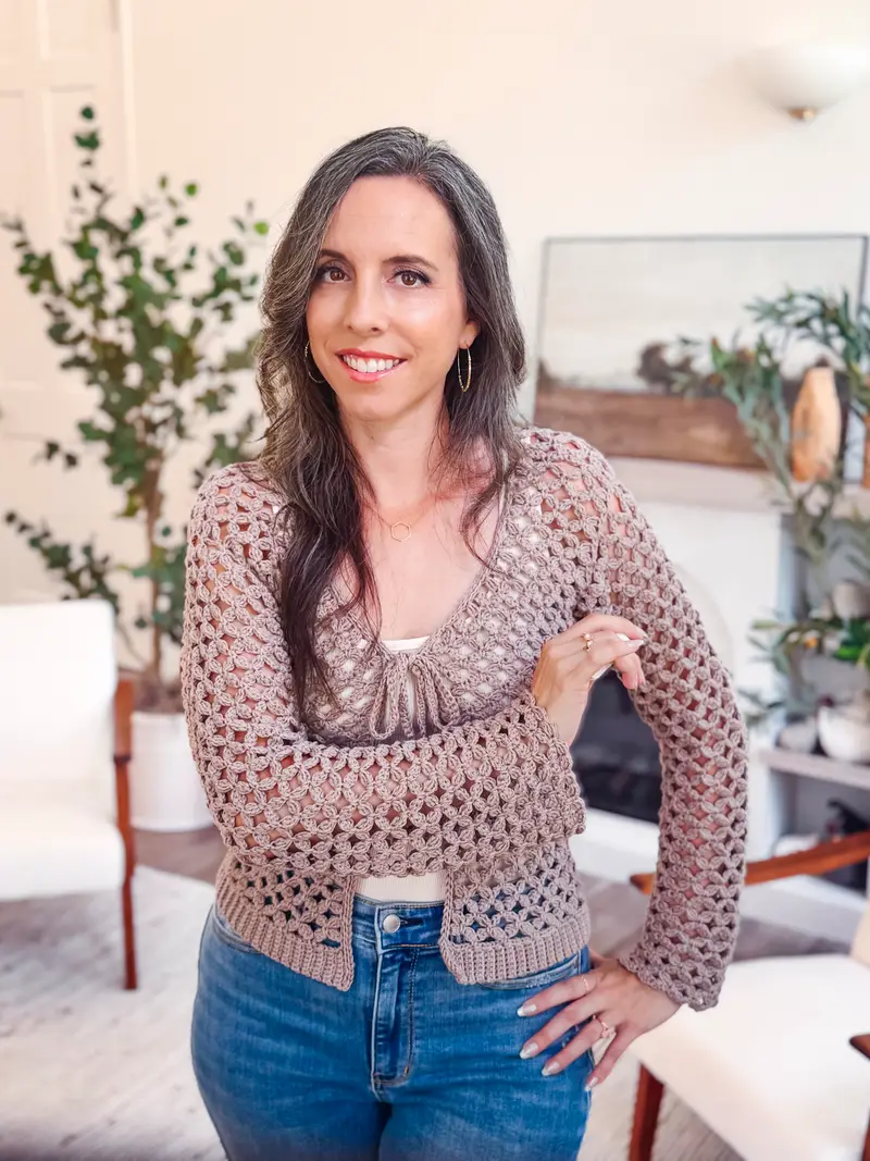 Woman wearing the taupe Circle Leaf V Neck Cardigan with a front tie