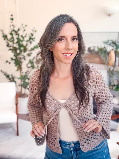 Taupe Circle Leaf V Neck Cardigan tied at the front over a cream top
