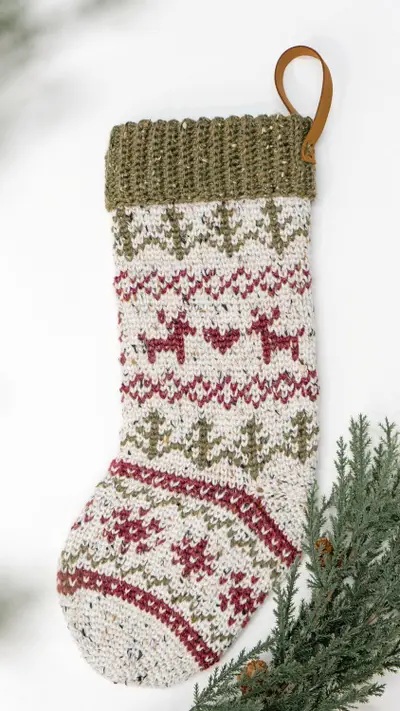 Classic Christmas Crochet Stocking with a leather hanging loop and pine sprigs