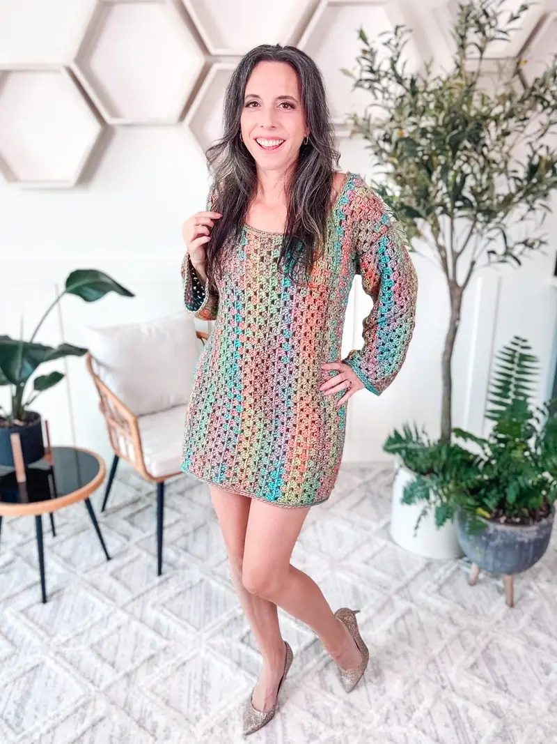 Woman wearing the Classic Granny Dress in rainbow granny stripes with long sleeves