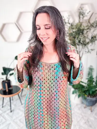Close up of the rainbow Classic Granny Dress worn by a smiling woman
