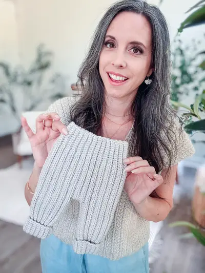 Woman holding up gray Cutest Baby Cuffed Pants