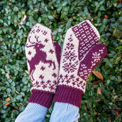 Close up of the deer and snowflake colorwork on the Deer Fair Isle Crochet Mittens