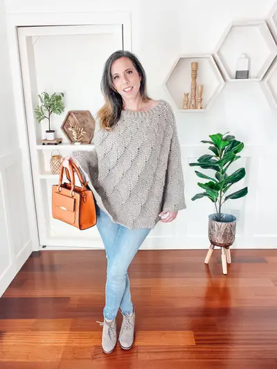 Full length view of the gray Enchanted Crochet Poncho with jeans