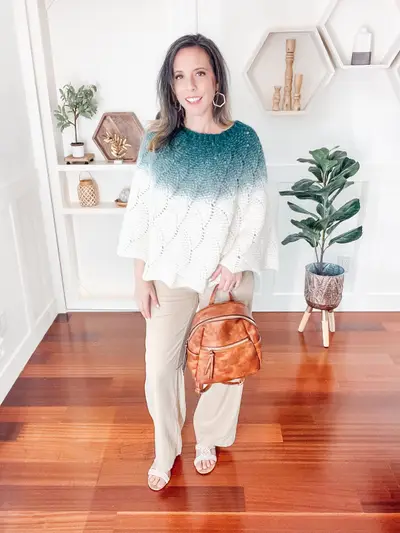 Enchanted Crochet Poncho in white fading to teal at the neckline