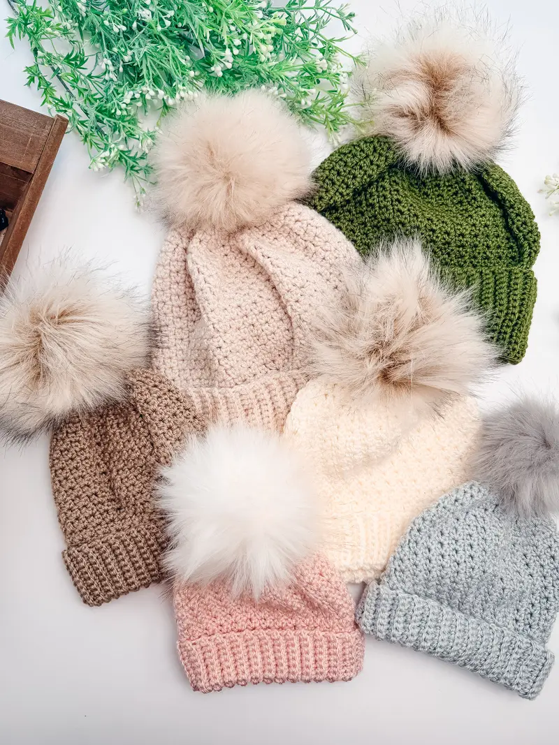 Extend That Mellow Texture Hats in tan, green, cream, pink and blue with faux fur pom poms