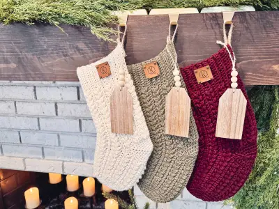 Three Festive Wheat Crochet Stockings hanging over a fireplace with candles