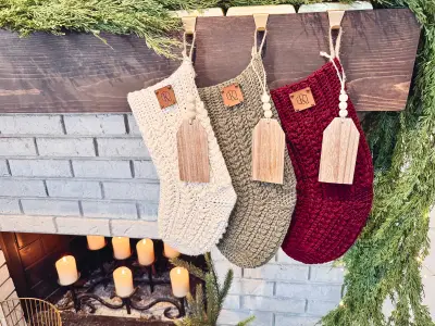 Festive Wheat Crochet Stockings in cream, sage and burgundy on a white brick mantel