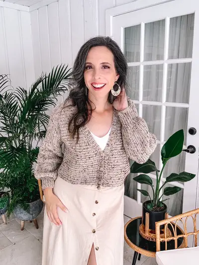 Tan tweed Finch Cardigan worn with a long cream skirt