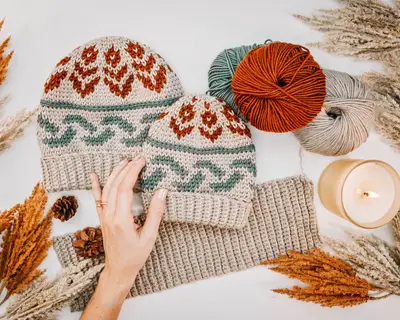 Forest Brooks Crochet Beanies with a cream ribbed brim, rust tulips and teal waves