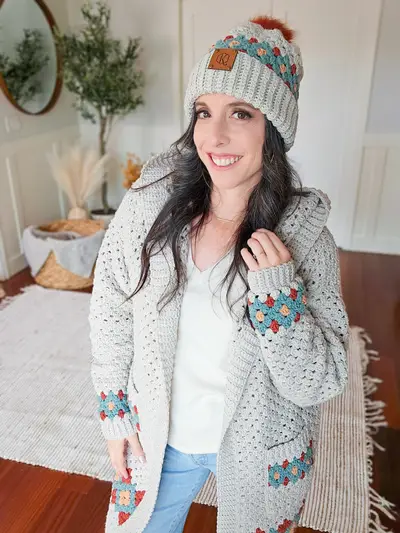 Woman in a gray Gemstone Hues Crochet Beanie with a matching cardigan