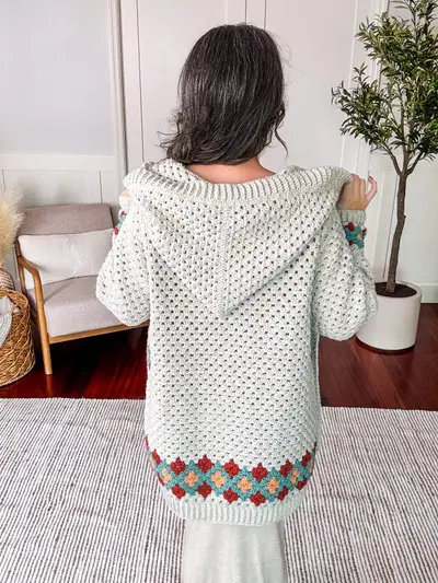 Back view of the hooded Gemstone Hues Crochet Cardigan with a diamond border