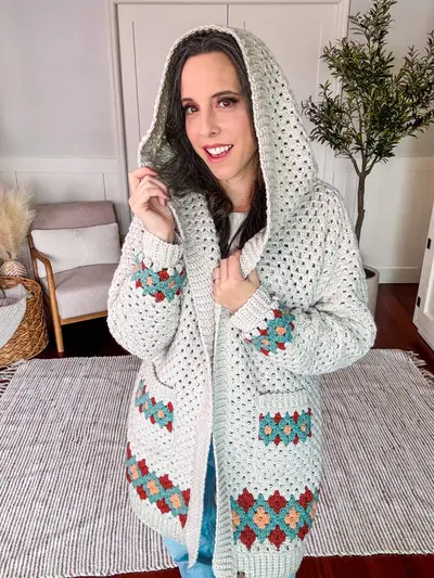 Woman with the hood up on the cream Gemstone Hues Crochet Cardigan
