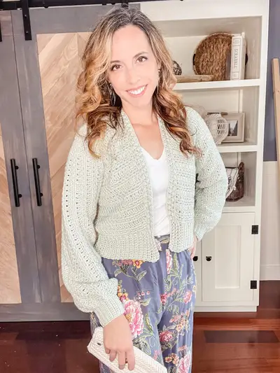 Sage green Get Comfy Crochet Cardigan worn over a white top