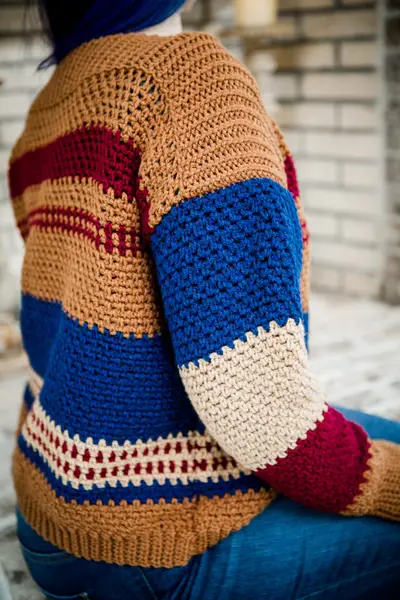 Close up of the Gingersnap Pullover stripes in mustard, navy and red