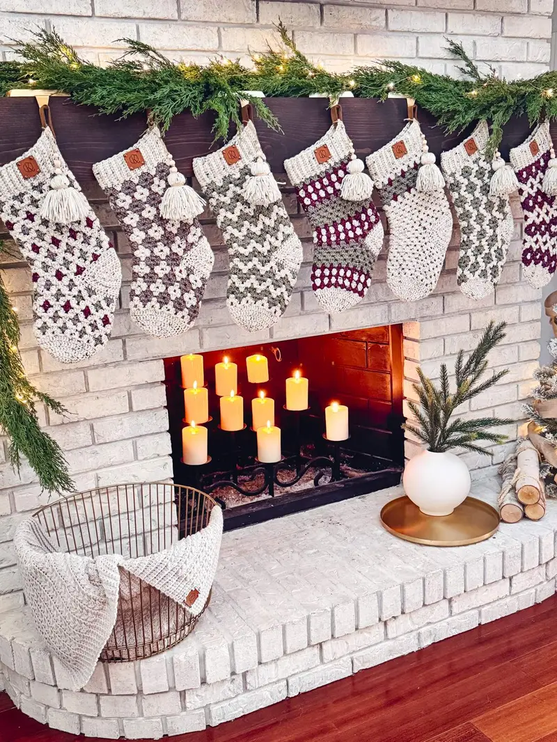 Granny All the Way Stockings hanging from a white brick fireplace with garland