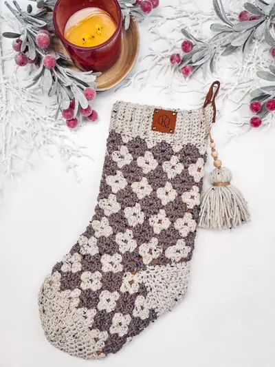 Gray and cream Granny All the Way Stocking with a wooden bead tassel