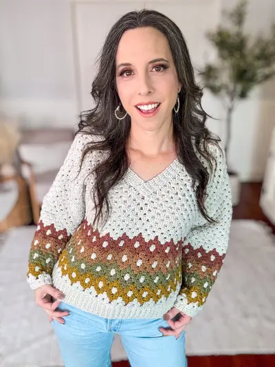 Smiling woman in the Shades of Diamonds Crochet Pullover with jeans