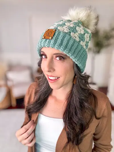 Smiling woman in the teal Harvest Hues Crochet Beanie