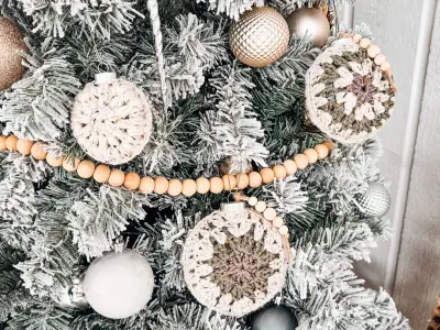 Hexagon Granny Bauble Ornaments on a frosted tree with wood bead garland