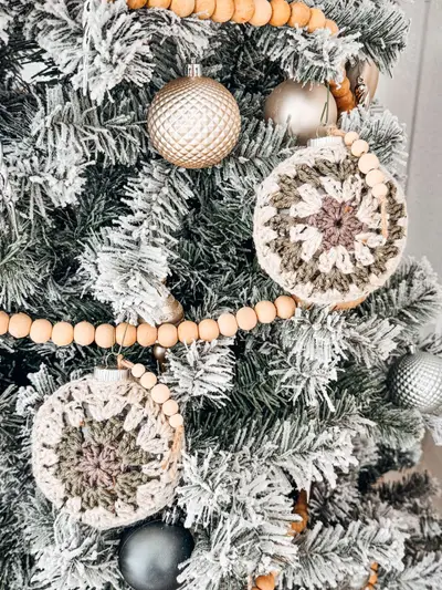 Cream and taupe Hexagon Granny Bauble Ornaments on a flocked tree
