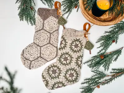 Pair of oatmeal Hexagon Granny Stockings with sage centers