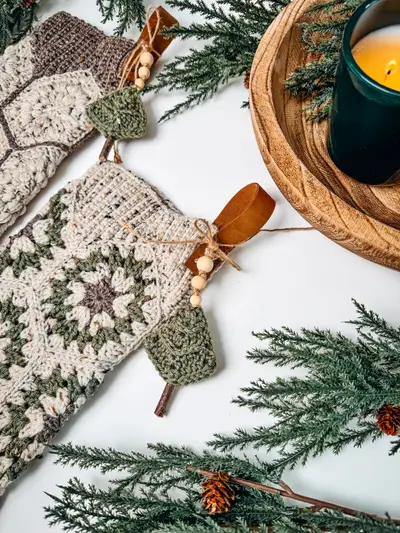 Hexagon Granny Stocking with a wooden spoon tag and greenery
