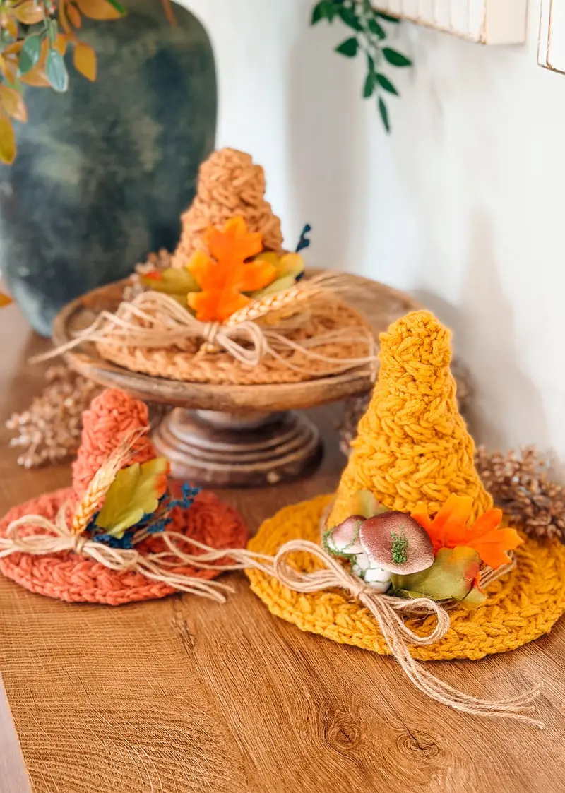 Home Decor Witch Hat Trio in orange, mustard and rust on a wooden stand
