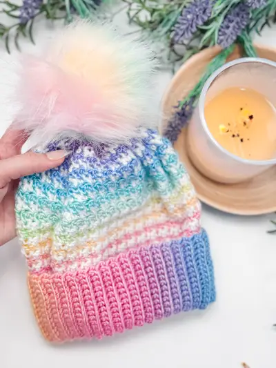 Rainbow Houndstooth Crochet Beanie with a pastel pom pom
