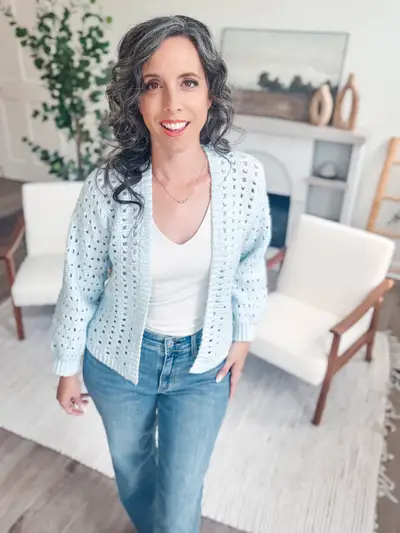 Light blue Hummingbird Cardi worn over a white top with jeans