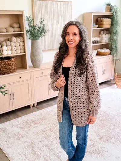 Woman wearing the long taupe Hummingbird Cardi with jeans