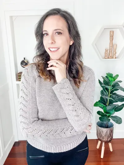 Woman in the gray Lovely Lace Crochet Sweater, a fitted long sleeve pullover