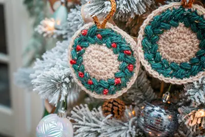 Macchiato Crochet Coasters made into green and oatmeal wreath ornaments on a Christmas tree