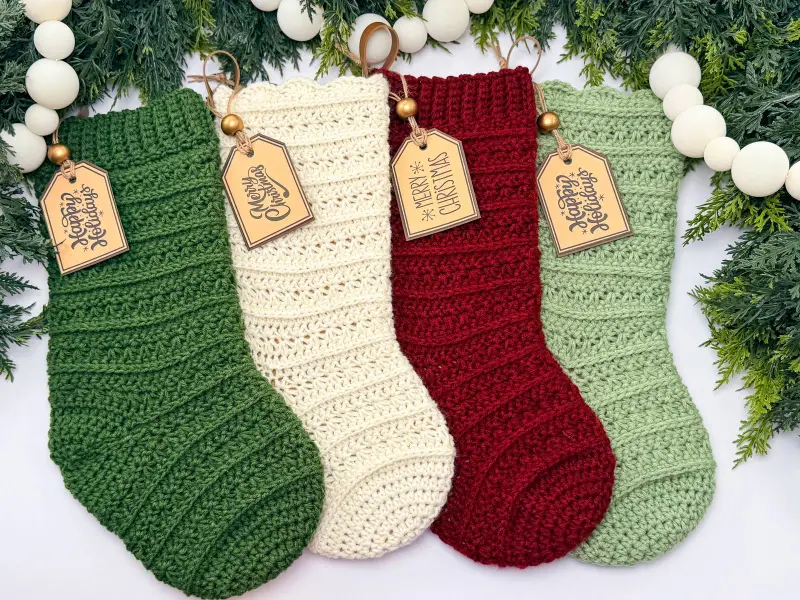 Petal Loop Stitch Stockings in green, cream, red and sage with wooden name tags