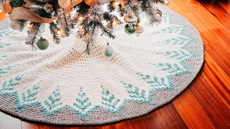 Pine Christmas Tree Skirt in cream with teal pine trees around the edge