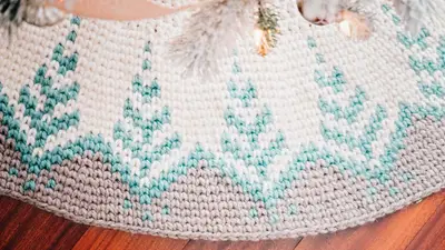 Close up of the teal pine tree colorwork on the Pine Christmas Tree Skirt