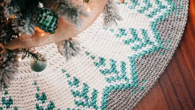Pine Christmas Tree Skirt under a flocked tree