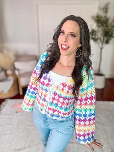Woman wearing the rainbow version of the Rainbow Hues Crochet Cardigan