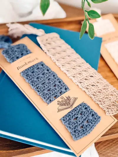 Reed Crochet Bookmarks in blue and cream on printed gift cards with a book