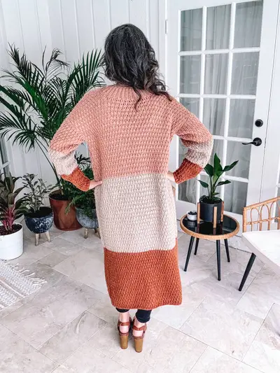 Back view of the rust and cream color block Robin Duster